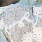 Vancouver Smocked Mock Neck With Floral Lace Detailed Top