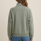 Back model view of sage pullover