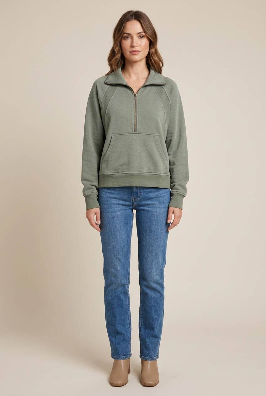 Full-body model view of sage pullover with jeans and ankle boots